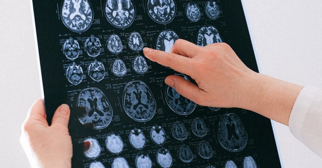 A medical professional examines a brain MRI scan, focusing on neurological health.